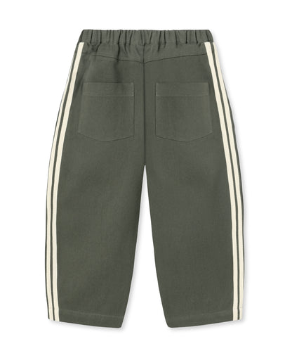 Fliink Donny Pant in beetle green cotton denim, back view showing two patch pockets and cream side stripes