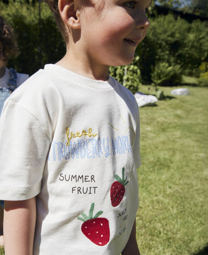 Close-up of the strawberry 'Summer fruit' print on the white tee