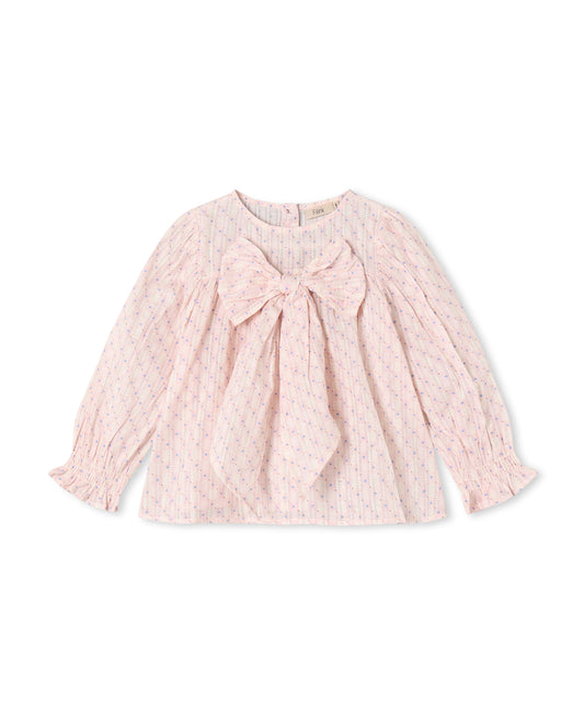 Chalk pink long-sleeved blouse with a large bow at the chest and smocked cuffs, shown flat