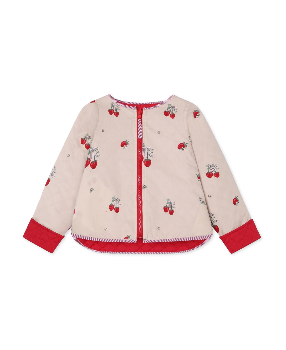 The jacket reversed to its sand-coloured strawberry print side, with red cuffs and zip